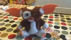 Reverse steps to reassemble Gizmo. Check he's working before sewing him up. Sew him up with a sharp sewing needle and brown thread.