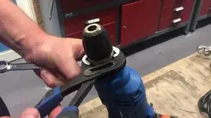 Using a pair of pliers, unscrew the chuck.