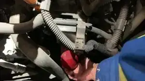 Loosen the oil filter by hand