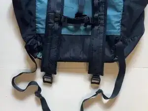 Disconnect both Speedy Clip buckles.