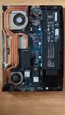 Carefully place the back panel onto the laptop and gently press down along the edges until you hear a click. One the panel is secure and not moving around, put every screw back into place and screw them in.