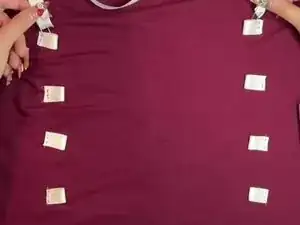 Insert the ribbon through the top loops.