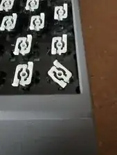 I found the easiest way to put these back is to put it on rotated to the left then spin it clockwise until it clicks.