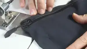 The last step is to re-sew the hem seam. If any sewing holes are still visible in the jacket, you can close them using the steam setting on an iron. Be sure that the iron does not touch the jacket!