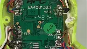 Use a soldering iron and solder wick to desolder the four motors from the control board.