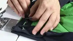 Sew the remaining zip half (without flap) onto the other side of the open jacket.