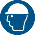 Dieses Zeichen zeigt an, dass hier ein Schutzhelm getragen werden soll.