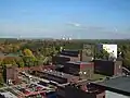 Die Kokerei der Zeche, und im Hintergrund sieht man die Stadt Gelsenkirchen.