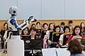 In Korea am Nationaltheater dirigiert dieser Roboter. Ob das ganz ernst gemeint ist?