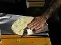 Der Spieß beim Adama Kebab wird hier gerade herausgezogen.