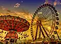 Die Cranger Kirmes in Wanne-Eickel mit einem Karussell und einem Riesenrad