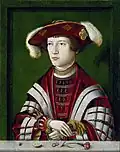 Ein reicher Adliger mit einer Zitronenscheibe. Das Bild wurde vor 500 Jahren in Deutschland gemalt.