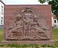 Auf dieser Mauer wird die Vereinigung der drei Stadtteile zur Stadt Saarbrücken dargestellt.
