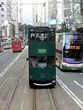 Doppeldecker-Tram und -Bus in Hongkong