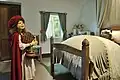 Mit dem verkleideten Wolf im Schlafzimmer. Wachsfiguren in einem Schloss in Frankreich.