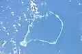Satellitenbild des Atolls, auf dem die Hauptstadt Fufunati liegt: Ein Atoll ist ein Saum von schmalen Inseln um ein Korallenriff.