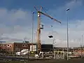 Der Ausleger eines Turmkrans wird auch als Arm bezeichnet.