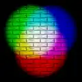 Eine Mischung von Lichtstrahlen in den Farben Rot, Grün und Blau. Alle drei Farben zusammen führen zum Weiß in der Mitte.