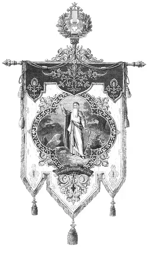 Die Gartenlaube (1865) b 473.jpg Die Sängerbundesfahne Nach dem Entwurfe von Adalbert Müller Berlin