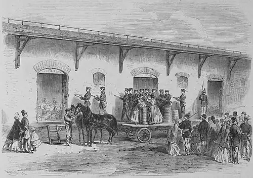 Die Gartenlaube (1866) b 485.jpg Die Speisung des zwanzigsten Landwehr-Bataillons auf dem Magdeburger Bahnhofe in Leipzig.