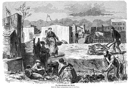 Die Gartenlaube (1872) b 459.jpg Die Barackenstadt von Berlin. Nach der Natur aufgenommen von L.&nbsp;Loeffler.