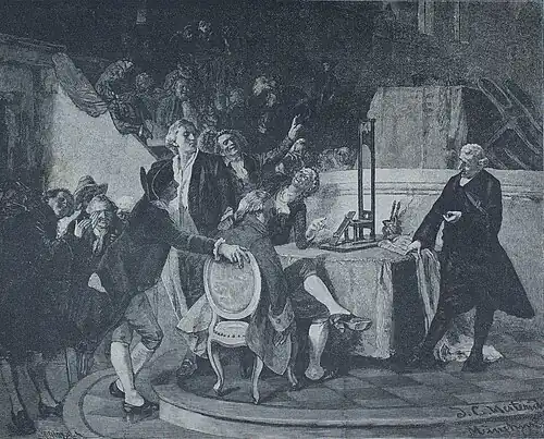 Die Gartenlaube (1884) b 061.jpg Guillotin zeigt dem Konvent das Modell der Guillotine. Nach dem Oelgemälde von J. C. Herterich
