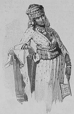 Die Gartenlaube (1895)_b_011_1.jpg Goldgesticktes vin den Frauen arabische Nomaden der Sahara getragenes Kopftuch mit schwarzen Wollfransen an denen große Silberringe hängen