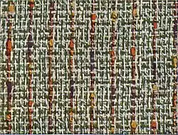 19. Noppen-Tweed mit dreifarbigem Noppenzwirn in Kettrichtung.