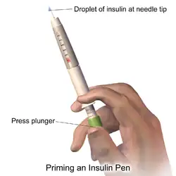 Priming an insulin pen.